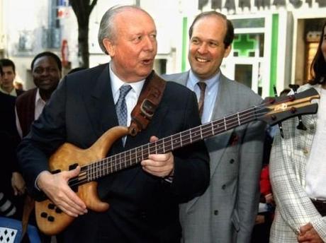 569430_jean-claude-gaudin-udf-candidate-for-the-coming-municipal-elections-in-marseille-plays-guitar-duri.jpg