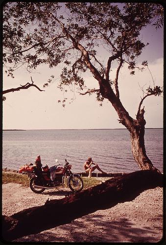 Vacationer From Ohio Relaxes near His Motorcycle During Sightseeing Tour of the Keys.