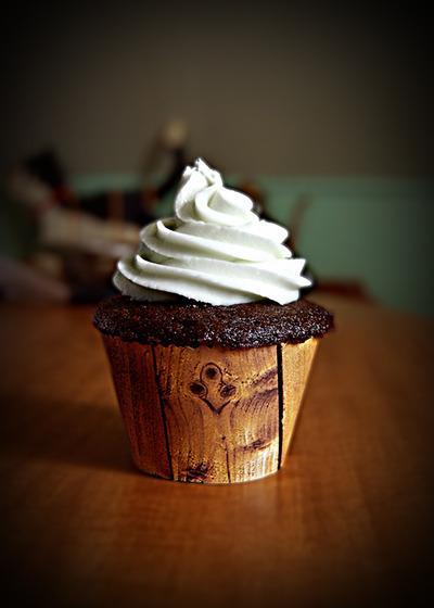 Chocolate cupcake with vanilla buttercream. I made the liner myself. Gotta love wood paneling.%0ASubmitted by NellieCakes