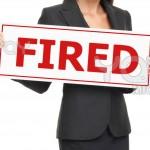 unemployment---woman-holding-fired-sign-on-white-7f78dd