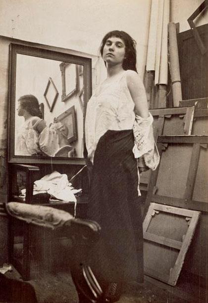 Modèle retirant sa blouse dans l’atelier parisien de Bonnard, ca 1916 -by Pierre Bonnard[Model getting ready for pose]
via rmn