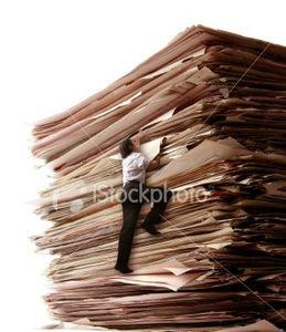 stock-photo-4145220-climbing-a-pile-of-files
