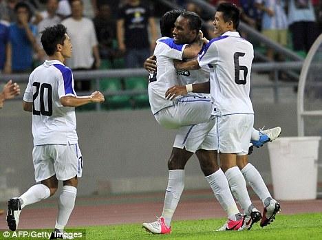 Thank Drog for that! Didier Drogba (centre) played the through ball which led to Shenhua's equaliser