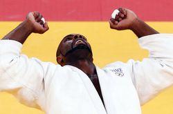 1041888_france-s-teddy-riner-celebrates-winning-his-men-s-100kg-gold-medal-judo-match-aginst-russia-s-alexander-mikhaylin-at-the-london-2012-olympic-games