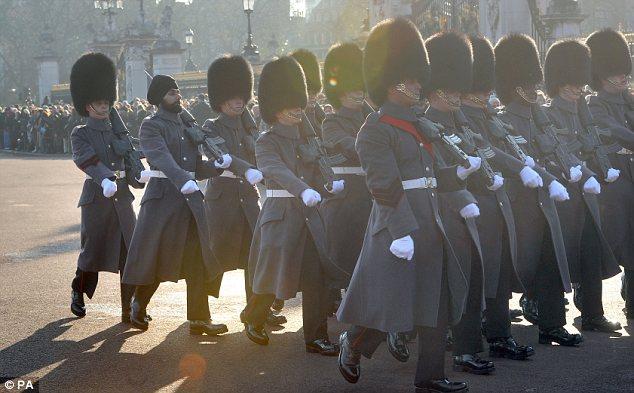 Odd one out: The Guards have worn bearskins for 180 years - with no exceptions until now