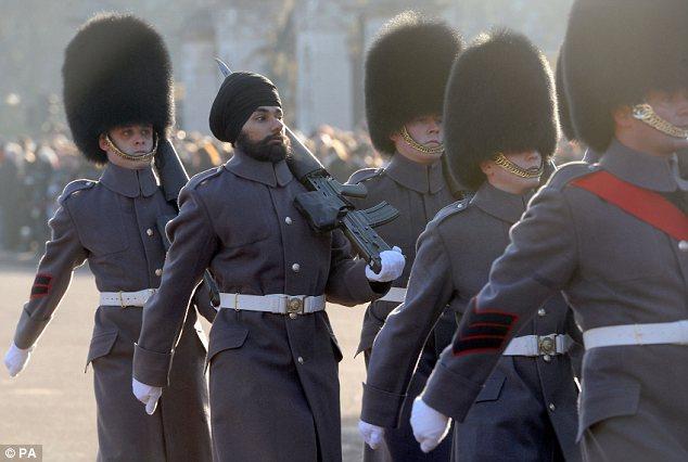 On parade: Jatinderpal Singh Bhullar, 25, participating in the Changing of the Guard wearing a turban