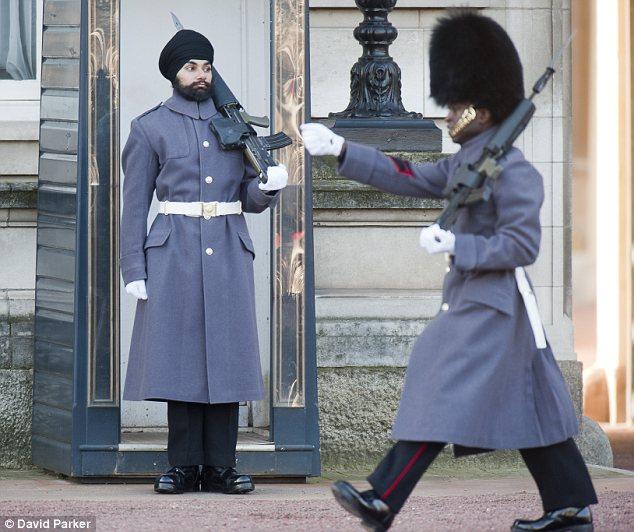 Guard: Bhullar is the first soldier posted at Buckingham Palace not to wear a bearskin