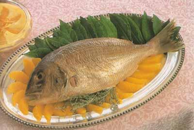 La daurade royale rôtie à la sarriette avec le beurre de gingembre à l’orange