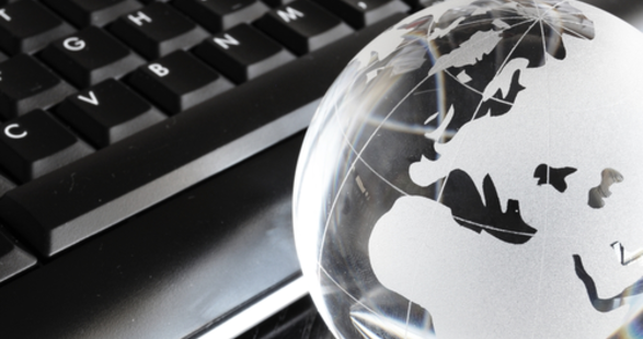 keyboard with globe representing the earth next to it