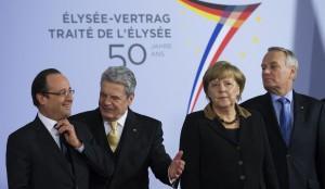 French President Hollande, German Chancellor Merkel, German President Gauck and France's Prime Minister Ayrault pose for pictures at Berlin Philharmonics