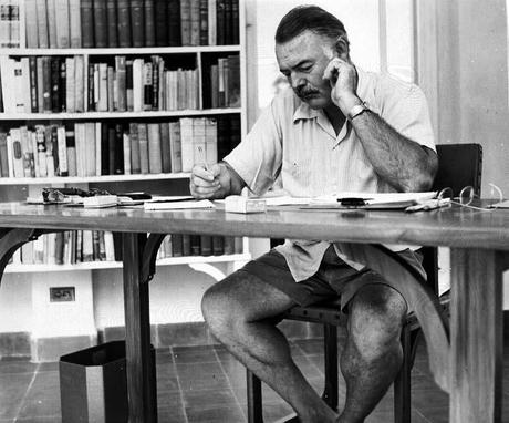 Hemingway_at_his_writing_desk.
