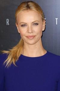 931893_cast-member-charlize-theron-poses-for-pictures-as-she-arrives-at-the-french-premiere-of-the-movie-prometheus-in-paris
