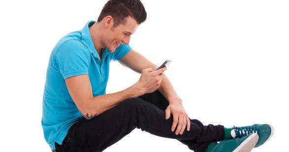 young man talking to his phone