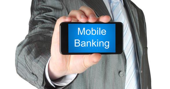 person holding a smartphone saying mobile banking
