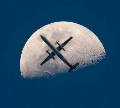airplane-passing-the-mooon-perfect-timing.jpg
