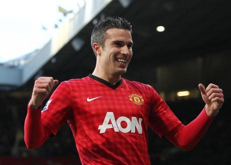 Robin van Persie of Manchester United celebrates scoring the opening goal of the game