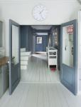 JOA STUDHOLME'S LONDON HOME: HALLWAY WITH WHITE PAINTED WOODEN FLOOR