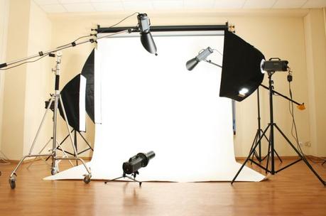 Empty photo studio with lighting equipment