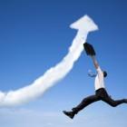 Jumping businessman with business growing graph cloud©Tom Wang-Fotolia