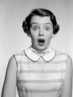 Studio portrait of surprised young woman