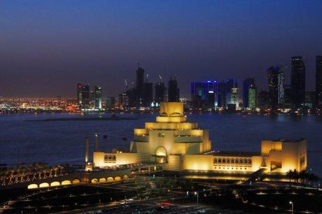 now-today-doha-is-internationally-known-for-its-latest-museum-the-qatar-museum-of-islamic-art-set-against-the-skyline-and-lit-up-at-night-the-museum-houses-the-citys-collection-of-manuscripts-textiles-and-ceramics
