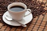 Coffee cup and beans Stock Photos