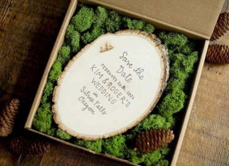 moss and pinecone filled wedding invitation