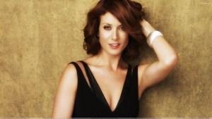 kate-walsh-smiling-red-lips-in-black-dress-and-cute-eyes