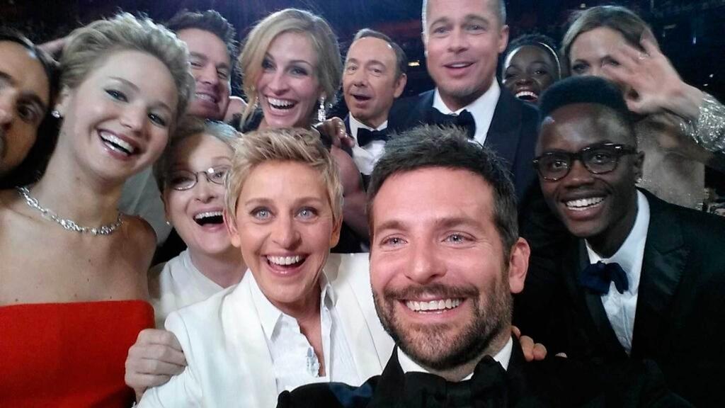 Oscars show host Degeneres on her Twitter account shows movie stars posing for a picture taken by Cooper at 86th Academy Awards in Hollywood, California