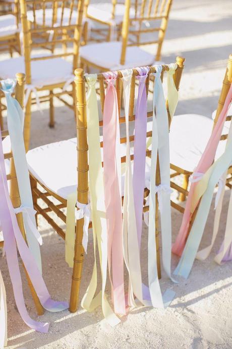Pastel chair ribbons | Photography: Darling Juliet Photography - darlingjuliet.com  Read More: http://www.stylemepretty.com/little-black-book-blog/2014/04/24/diy-pastel-islamorada-wedding/