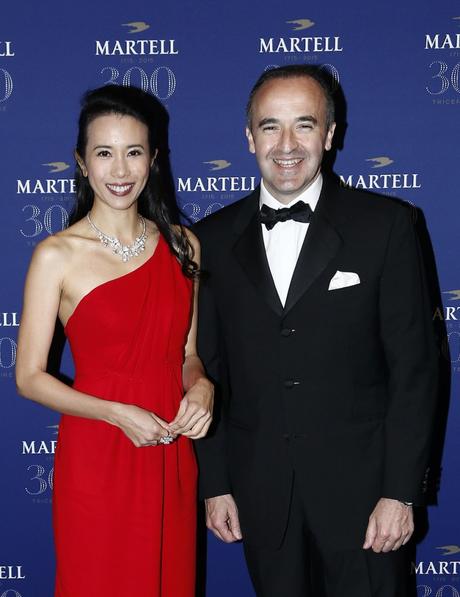 VERSAILLES, FRANCE - MAY 20:  Actress and singer Karen Mok (L) and Philippe Guettat, Martell CEO and Chairman, are pictured arriving at Martell Cognac's 300th anniversary event at the iconic Palace of Versailles on May 20, 2015 in Versailles, France.  (Photo by Julien M. Hekimian/Getty Images for Martell Cognac)