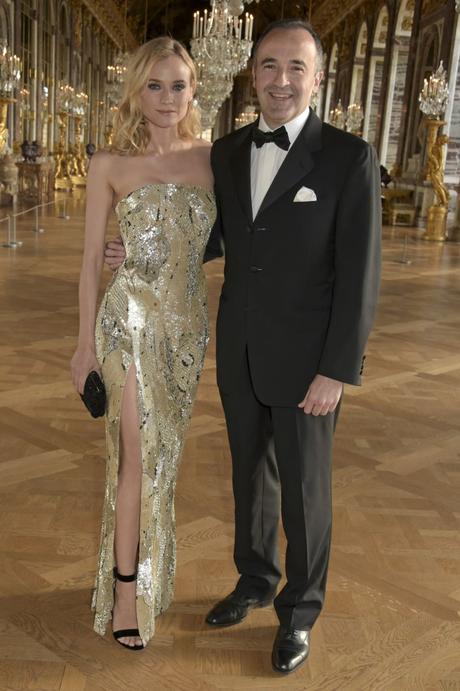 VERSAILLES, FRANCE - MAY 20: Diane Kruger, Ambassador of Martell Cognac's Tricentenaire and Philippe Guettat, Martell CEO are pictured during a spectacular evening honouring the cognac House's 300th anniversary at the Palace of Versailles  (Photo by David M. Benett/Getty Images for Martell Cognac)