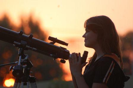 Teen girl and telescope.  Near Kiev,Ukraine