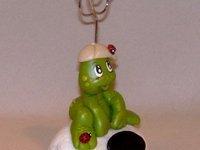 Porte-photo avec p'tite grenouille sur cailloux en porcelaine froide