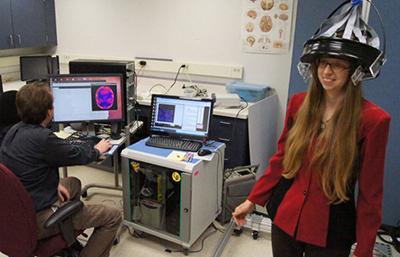 Julie Brefczynski-Lewis demonstrates portable PET brain scanning