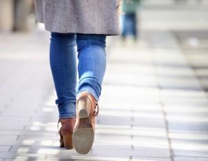 Woman walking into bright light (future?)