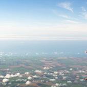 Daring performer completes highest static trapeze act ever suspended from hot air balloon in New Zealand