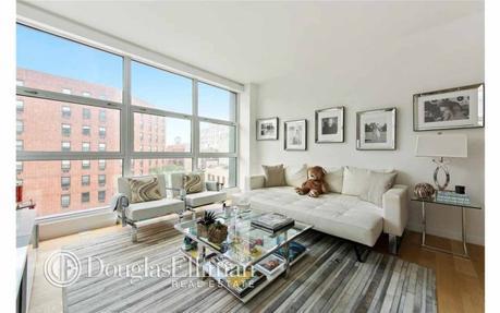 all-white-decor-pale-wood-floors-and-bowery-views-keep-the-living-space-feeling-airy-and-bright