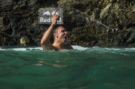 Michal Navratil of Czech Republic celebrates after diving from the 27.5 metre platform at the Blue Lagoon during the sixth stop of the Red Bull Cliff Diving World Series in Pembrokeshire, Wales on September 10, 2016.