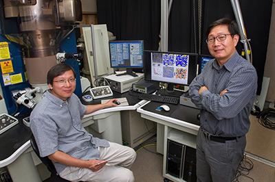 Brookhaven physicist Qiang Li (right) and materials scientist