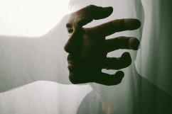 Conceptual portrait of a man searching within himself