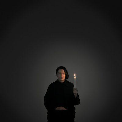 Marina Abramovic, portrait with a cancle