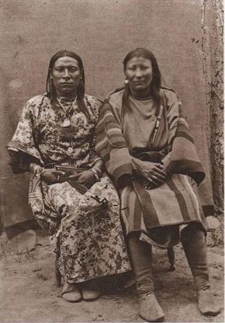 Squaw Jim / Osh-Tish (Finds Them and Kills Them), Crow tribe. On the left is Squaw Jim, a biological male in woman’s attire, his wife to the right. Afforded distinctive social and ceremonial status within the tribe. Squaw Jim served as a scout at Fort Keogh and earned a reputation for bravery after saving the life of a fellow tribesman in the Battle of the Rosebud, June 17, 1876.