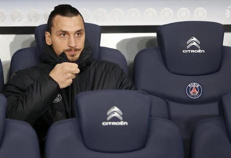 Paris St Germain's Zlatan Ibrahimovic sits on the bench as he attends his team's French Ligue 1 soccer match against Olympique Marseille at the Parc des Princes stadium in Paris November 9, 2014. REUTERS/Charles Platiau (FRANCE - Tags: SPORT SOCCER)