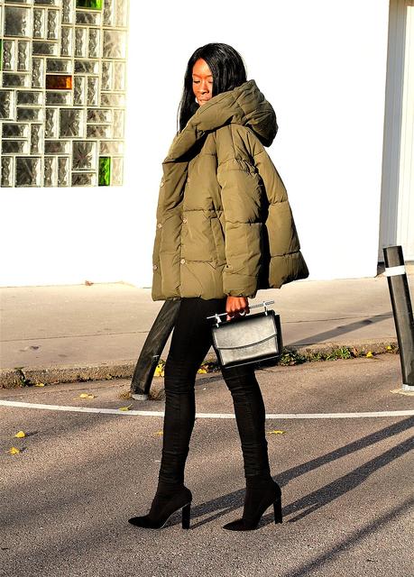 style-blogger-rocking-puffy-jacket-sock-boots-fashion-trend-2017