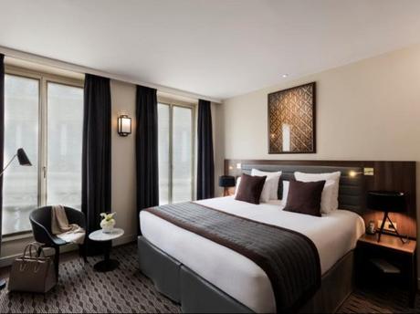 Chambre deluxe à l'Hôtel Kapital Opéra Paris Chambre deluxe à l'Hôtel Kapital Opéra Paris