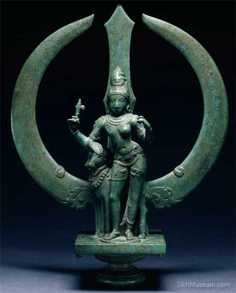 Trident with Shiva as Ardhanari (Half-Woman)  ca. 1050, Chola dynasty, South India. A Shiva sculpture almost a thousand years old can easily be mistaken for the Sikh Khanda emblem. To learn more see the SikhMuseum.com Exhibit - Nishan Sahib, History of the Sacred Banner and its Symbols