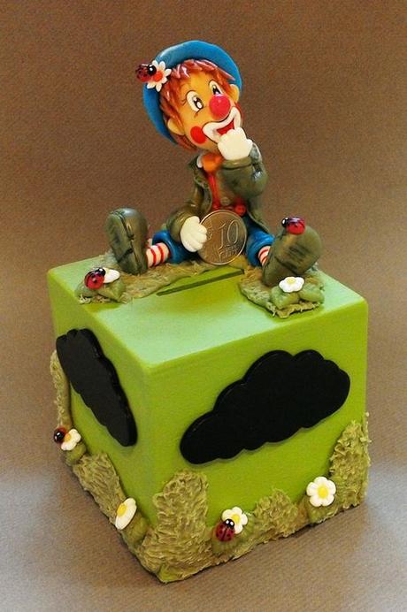 Tirelire avec clown en porcelaine froide