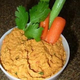 Wonderful for entertaining, this high volume hummus recipe is made with chipotle pepper, roasted red peppers, and sun dried tomatoes. The Middle-Eastern-inspired dip is a beautiful color and has a smoky, bright flavor. Serve with pita chips and fresh v...