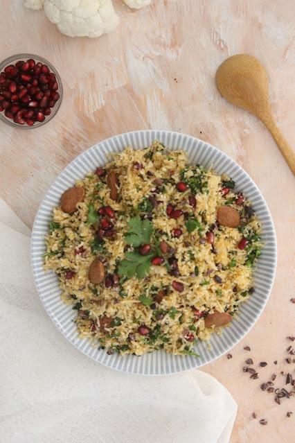 Cuillère et saladier : Salade de semoule de chou fleur à la grenade, ras-el-hanout, amandes et fèves de cacao